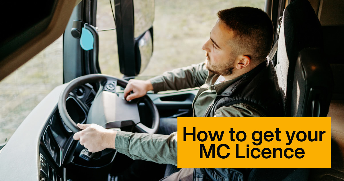 Driver and trainer beside a heavy vehicle during MC licence training in Newcastle